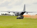 A C-130J and Land Rover