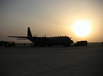 A C-130J at sunset