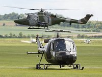 The Lynx crosses behind the AHAF Scout.