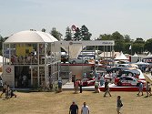 The display area includes large stands from motor manufacturers            such as Vauxhall....