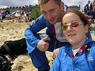 Brian and Andrea distributing posters among the huge crowd on the beach.