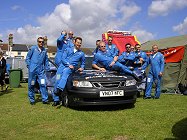 You really can get this much in a Saab! The Team with their vehicle.