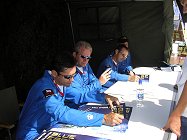 The Team poster signing at the meet the pilots tent.