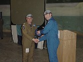 Capt Ray Turner receives his coveted blue helmet from Lt Col Hugh Northam