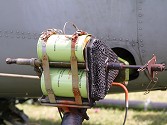 The smoke bombs are standard army issue, as used by parachutists to mark their descents, fitted in threes in a rig on the undercarriage leg