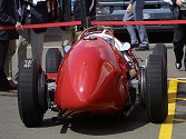 In the Ferrari paddock, something special, a 1950's Grand Prix car, gleaming in the evening sun