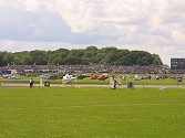 A view across a small part of the helicopter parking area shows the huge number of aircraft, as well as the size of the crowd by 11:30 in the morning