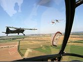 Leaning out of the side panel gave Keith a view of the fixed wings in line astern.